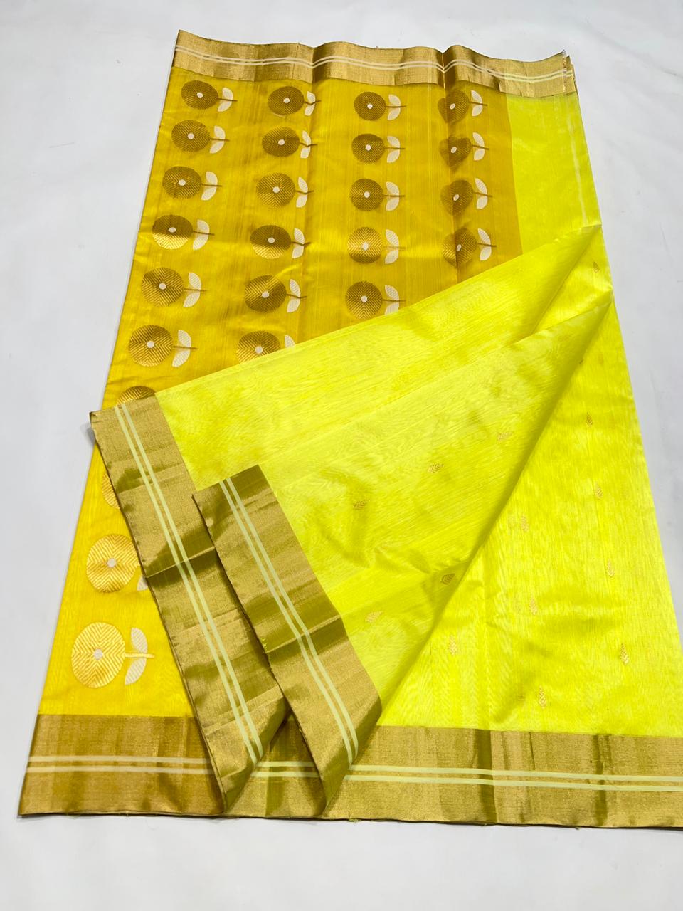 Full view of a Lemon Yellow Chanderi Pattu soft silk saree showing the contrasting golden-yellow pallu with large floral motifs and the matching blouse piece.