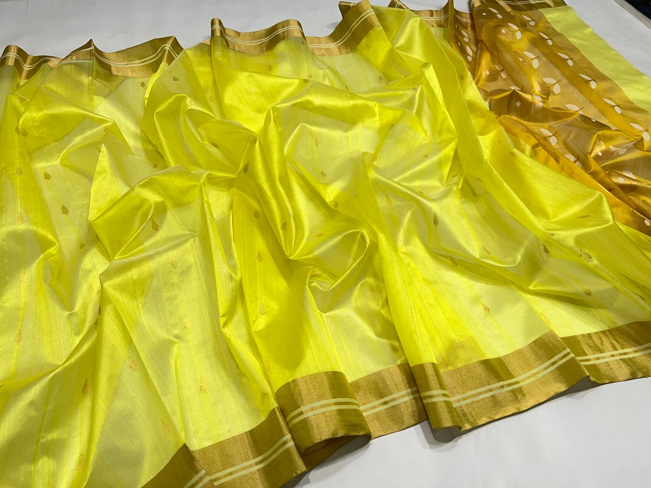 Close-up drape view of a Lemon Yellow Chanderi Pattu soft silk saree, showcasing the lightweight translucent fabric, delicate gold leaf buttis, and a sleek zari border.