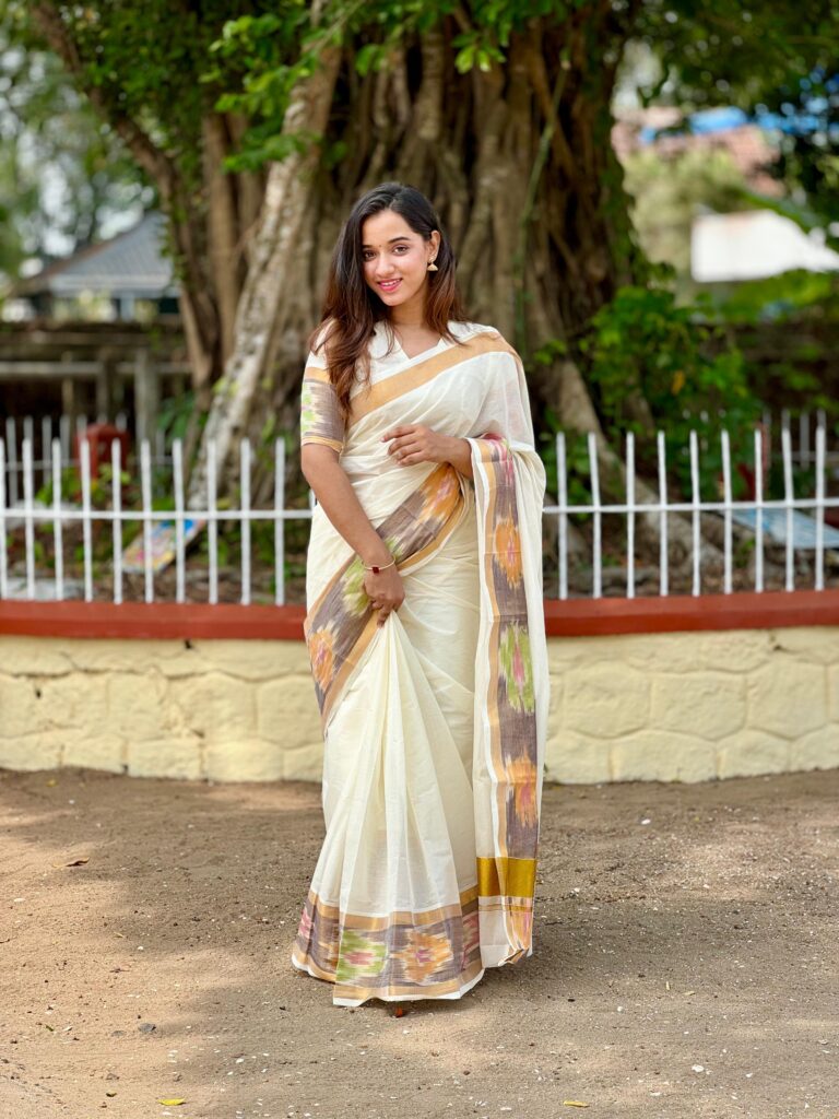 A Kerala model in a Pochambally border Kerala Kasavu Saree