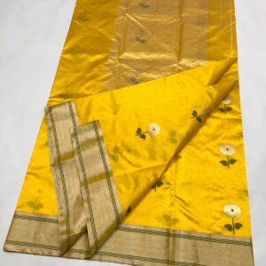 Detailed view of the Sunflower Yellow Chanderi Pattu handloom saree showing the matching blouse piece section and the elegant zari border.