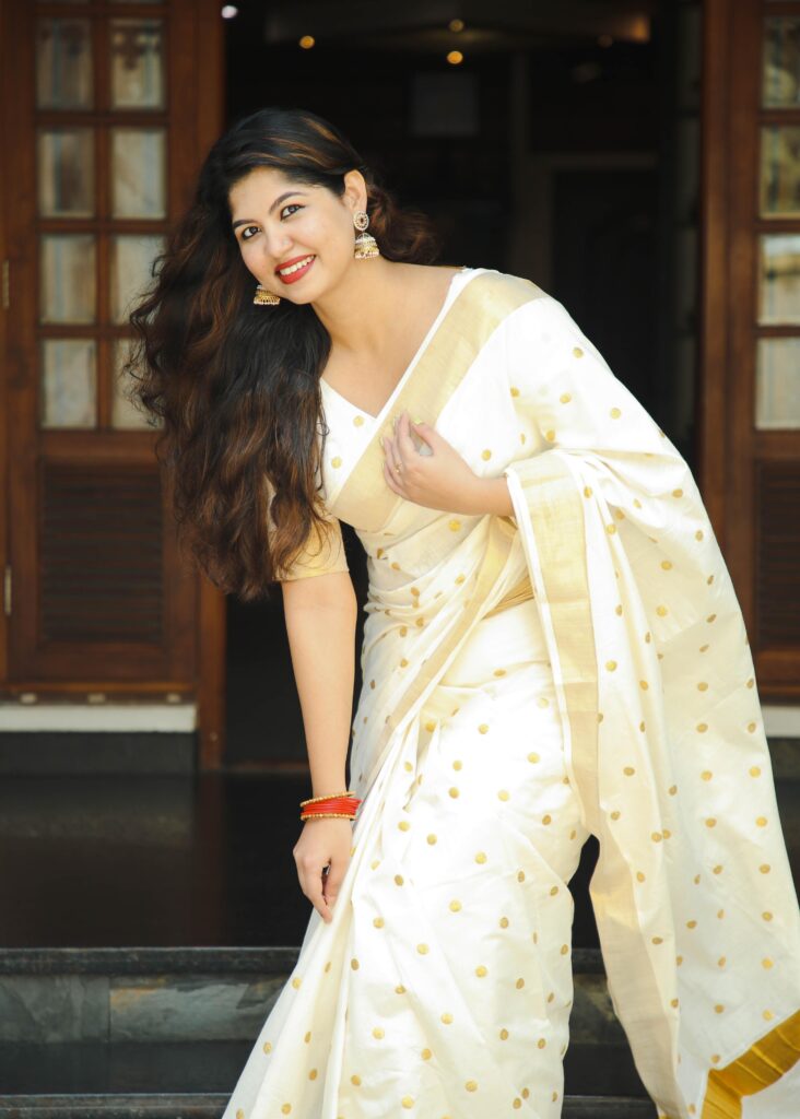 An Indian model in a Small Polks Kerala Kassavu Saree
