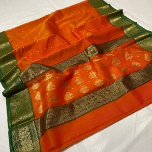 Open view of a Vibrant Mango Orange Chanderi Katan Silk Saree featuring traditional gold zari floral motifs on the lower half and a deep forest green border. Perfect for wedding receptions and festive luxury