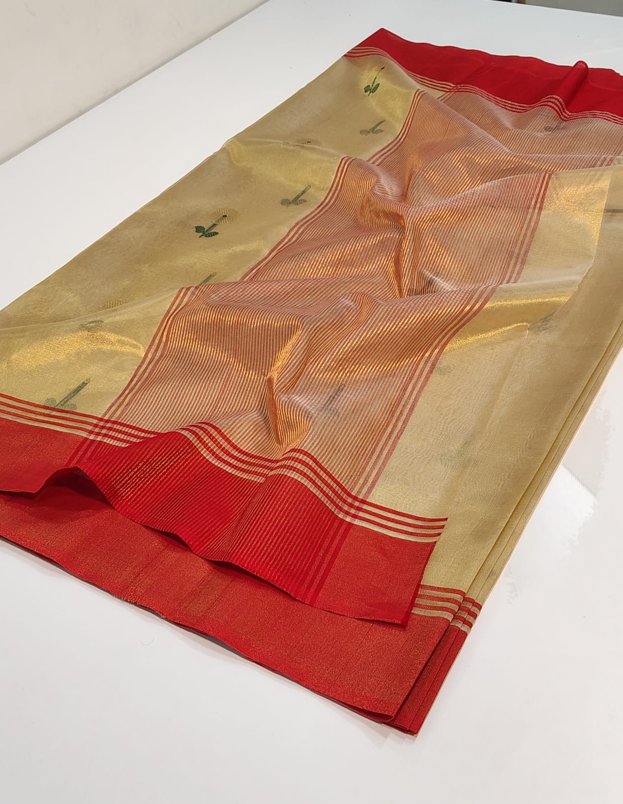 Full view of Champagne Gold Chanderi Tissue saree featuring a vibrant Crimson Red striped border and pallu.